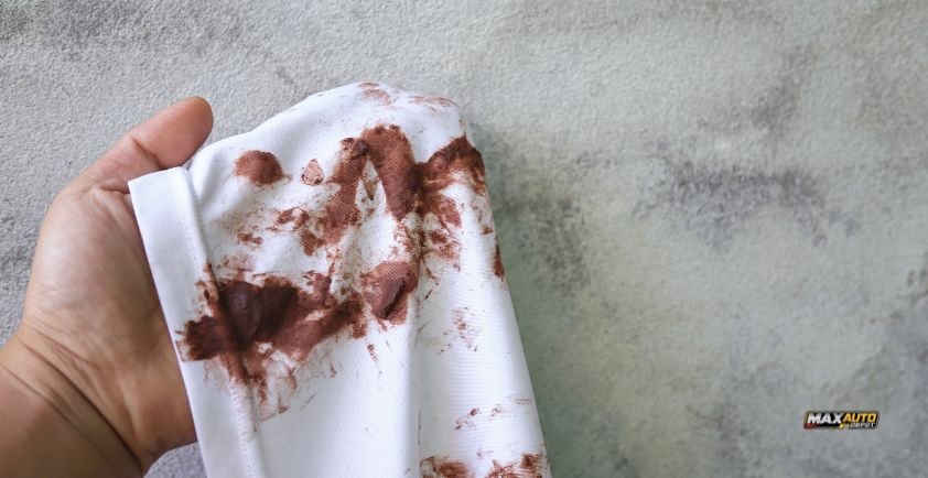how to get transmission fluid out of clothes